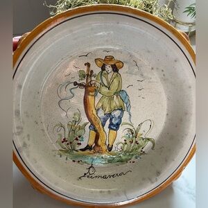 This is a hand-painted Italian pottery wall plate